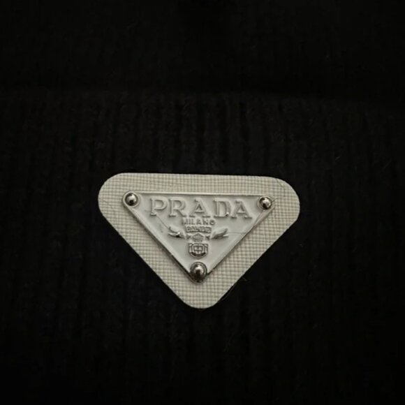 Prada Knit Ribbed Beanie in black with silver logo